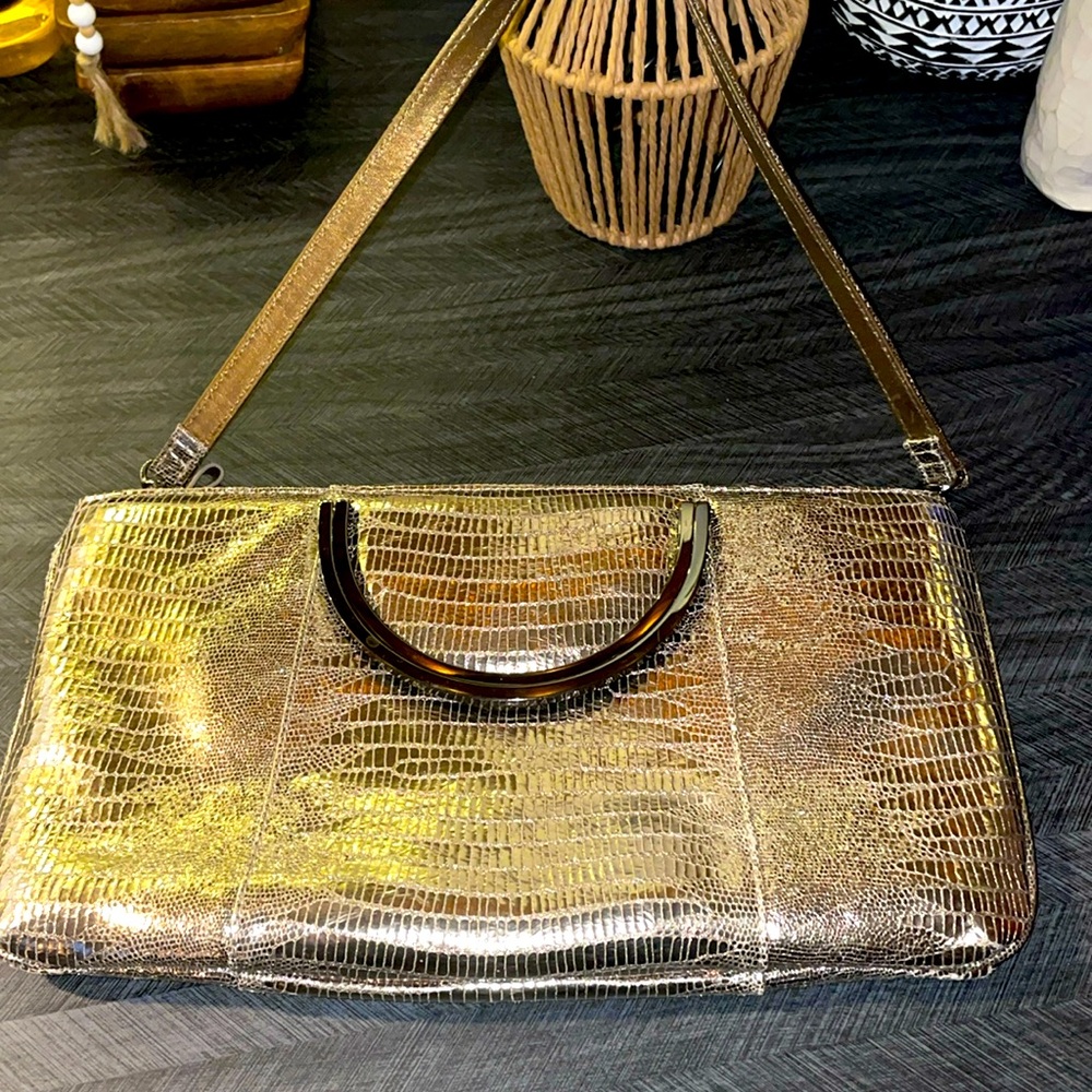 Elegant gold Clutch with Black Handle